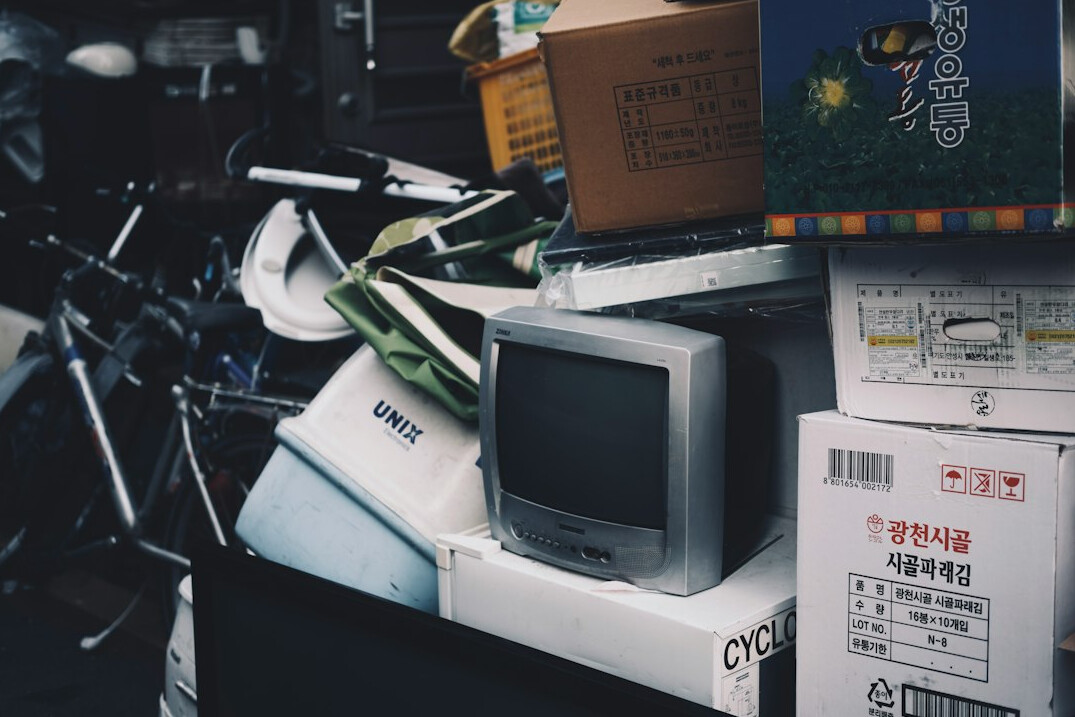 Close-up of vintage CRT television monitors stacked together